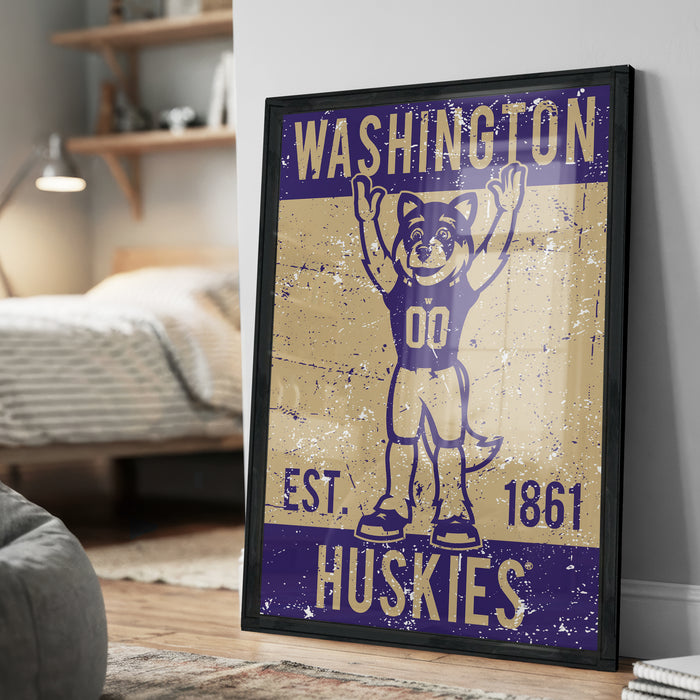 A framed poster featuring a graphic of a mascot character with the text "WASHINGTON HUSKIES" and "EST. 1861" printed on it.