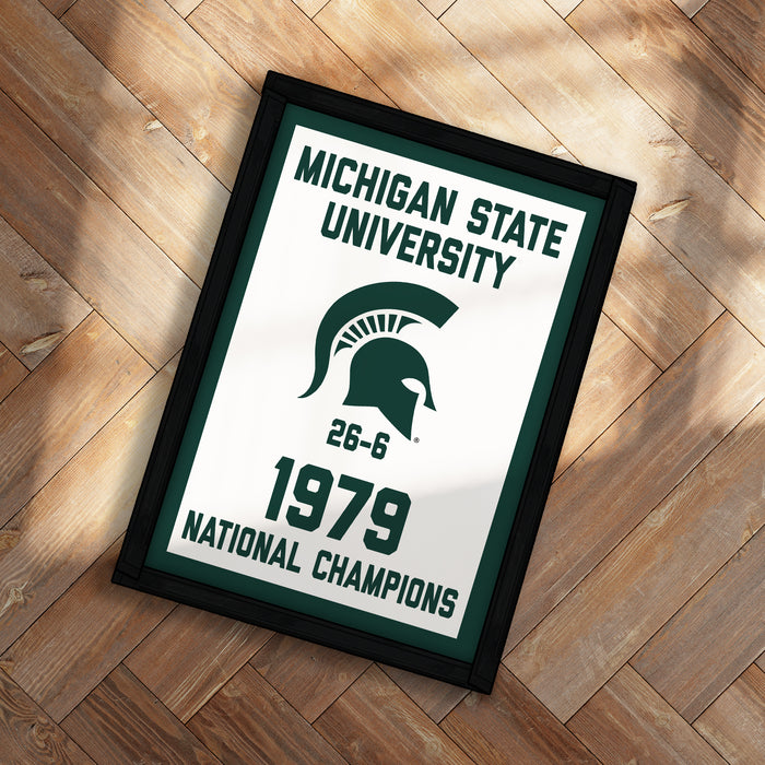 A framed poster with the text "Michigan State University" and "National Champions" on it, along with a graphic of a helmet and the year "1979".