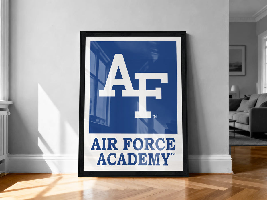 a framed poster with the Air Force Academy logo on a wall.