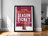 A framed poster advertising Virginia Tech's season ticket holder, with the text "LANE STADIUM VIRGINIA TECH SEASON TICKET HOLDER" prominently displayed.