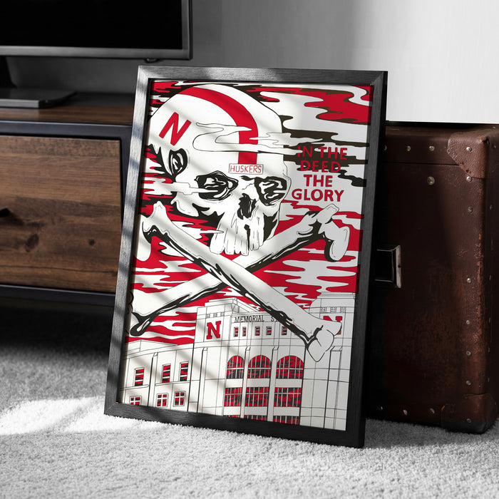 A framed poster with a skull and crossbones design, featuring the text "In the Glory" and "HUSKIES" on it.