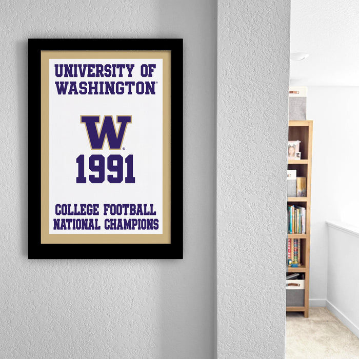 a framed poster on a wall that reads "UNIVERSITY OF WASHINGTON W 1991 COLLEGE FOOTBALL NATIONAL CHAMPIONS".