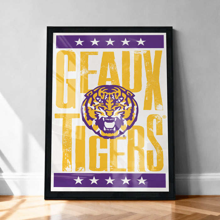 A framed poster with the text "GEAUX TIGERS" and a graphic of a tiger's head.