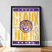 A framed poster with the text "GEAUX TIGERS" and a graphic of a tiger's head.