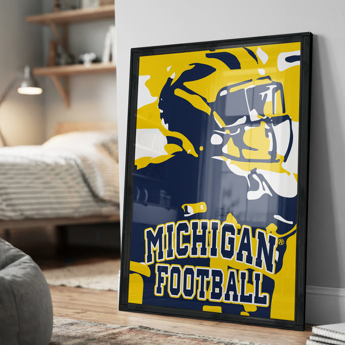 A framed poster of a football player in a Michigan football uniform, with the text "Michigan Football" prominently displayed.