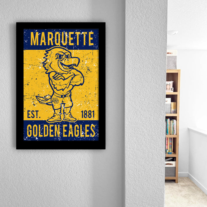 a framed poster of a cartoon character, likely representing the Marquette University Golden Eagles, displayed on a wall.