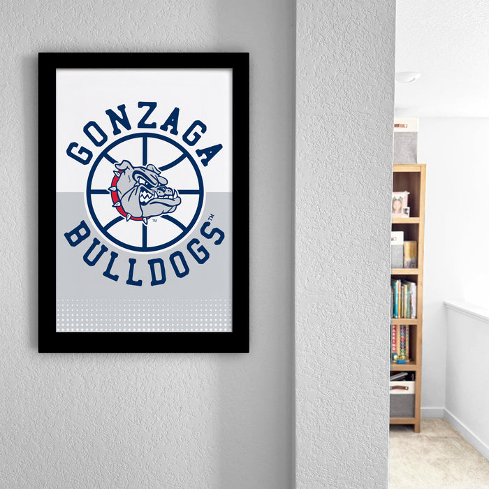 a framed poster of the Gonzaga Bulldogs basketball team logo, which is displayed on a wall in a room.