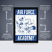 The image is a poster for the Air Force Academy, featuring a stylized illustration of a bird with wings and a sword. The poster is described as " Officially licensed" and "Premium printed", indicating that it is a high-quality, professionally printed poster. The poster is also described as a "Shipped flat" and "The perfect gift", suggesting that it is a thoughtful and practical gift option.