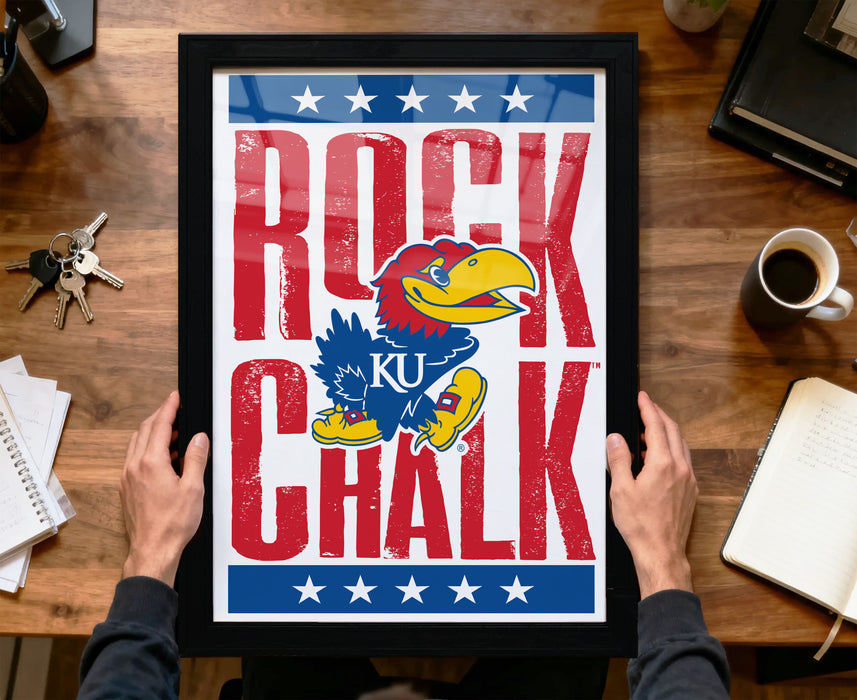 A framed poster featuring a cartoon bird character with the text "ROCK CHALK" prominently displayed.