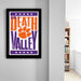a framed poster with the text "Welcome to Death Valley" and an orange paw print graphic.