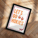 A framed poster with the text "LET'S GO HOKIES" and two orange bird silhouettes is displayed on a wooden floor.