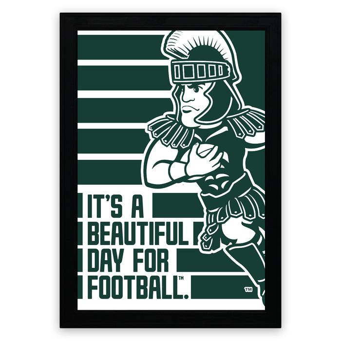 A framed poster featuring a cartoon illustration of a football player in a green and white uniform, with the text "It's a beautiful day for football."