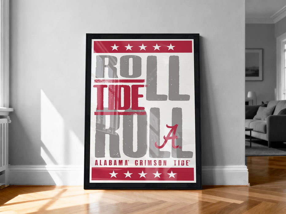 A framed poster with the text "ROLL TIDE A" in large letters, surrounded by red stars, is displayed on a wall in a room.