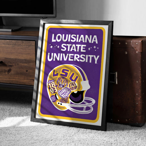 A framed poster of a LSU football helmet, with the text "LOUISIANA STATE UNIVERSITY" prominently displayed.