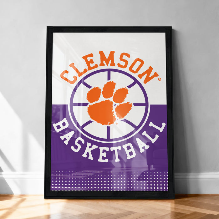 A framed poster with the text "CLEMSON BASKETBALL" and an orange paw print symbol, indicating the team's logo.