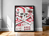 A framed poster with a skull and crossbones design, featuring a building and text, is displayed on a wall in a room.