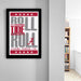 a framed poster with the text "ROLL TIDE ROL" and "ALABAMA CRIMSON TIDE" printed on it, hanging on a wall.