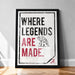 A framed poster with the text "WHERE LEGENDS ARE MADE." and an illustration of an elephant.