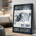 A framed poster with the text "UNITED STATES NAVAL ACADEMY EST. 1845" and an illustration of a bull, representing the naval academy.