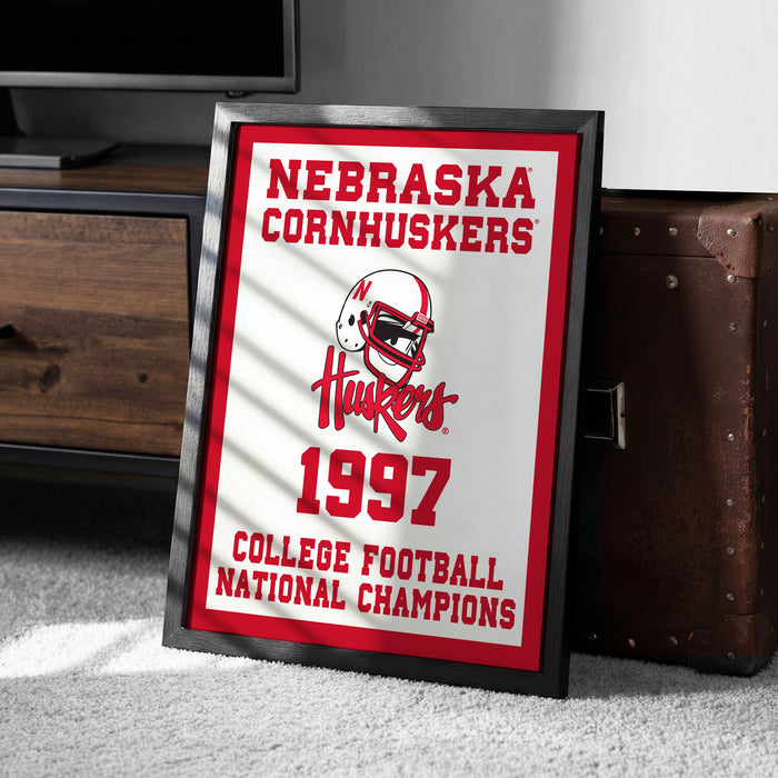A framed sign displaying the Nebraska Cornhuskers' 1997 College Football National Champions.