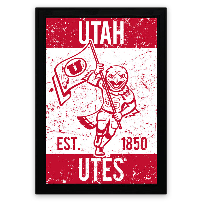 A framed poster featuring a stylized illustration of a bird holding a flag, with the text "UTAH EST. 1850 Utes" prominently displayed.