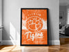 a framed poster of the Clemson Tigers basketball team, with a distressed orange and white color scheme.