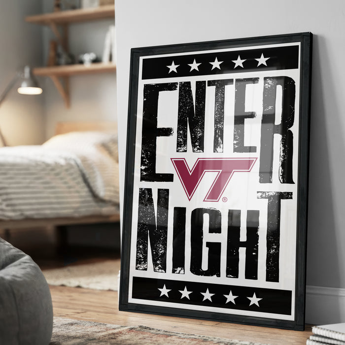A framed poster with the text "ENTER NIGHT" and a logo, placed on a wall in a bedroom.