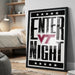A framed poster with the text "ENTER NIGHT" and a logo, placed on a wall in a bedroom.