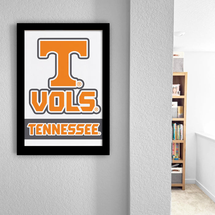 a framed poster of the Tennessee State University (TSU) logo hanging on a wall.