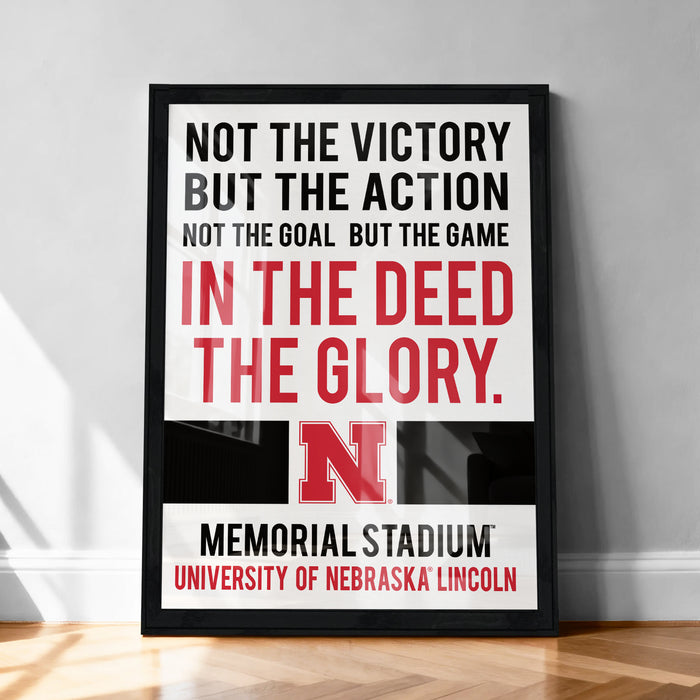 The image is a framed poster with a motivational message about the importance of action and the game over the victory, displayed on a wall.