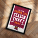 A framed poster advertising Virginia Tech's season ticket holder, featuring the university's logo and text.