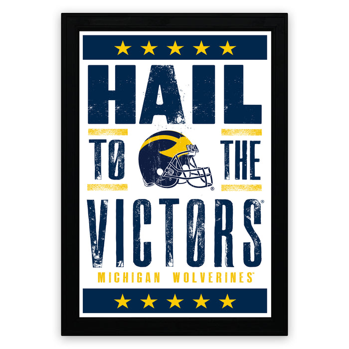 The image is a framed poster featuring the text "Hail to the Victors" and a graphic of a football helmet, likely representing the Michigan Wolverines football team.