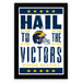 The image is a framed poster featuring the text "Hail to the Victors" and a graphic of a football helmet, likely representing the Michigan Wolverines football team.