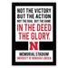 a framed quote that reads "NOT THE VICTORY BUT THE ACTION NOT THE GOAL BUT THE GAME IN THE DEED THE GLORY." The quote is from the Memorial Stadium University of Nebraska Lincoln.