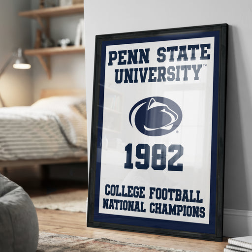 A framed poster on a wall celebrating Penn State University's 1982 College Football National Champions.