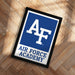 a framed sign with the logo of the Air Force Academy.
