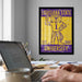 a framed poster of a tiger mascot from Louisiana State University, with a laptop and a coffee mug on a desk in the foreground.