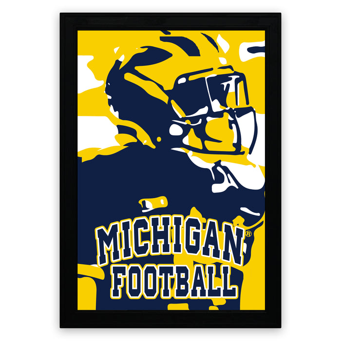 A framed poster featuring a stylized illustration of a football player in a Michigan football uniform.