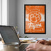 a framed poster of the Clemson Tigers basketball team on the wall, with a laptop and coffee cup on a desk in the foreground.