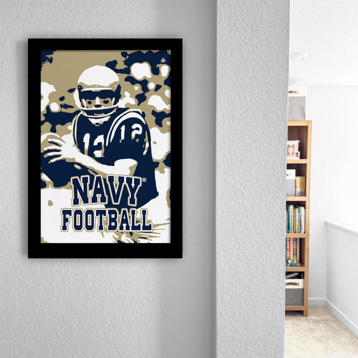 a framed poster of a football player wearing a navy uniform, with the text "NAVY FOOTBALL" prominently displayed.