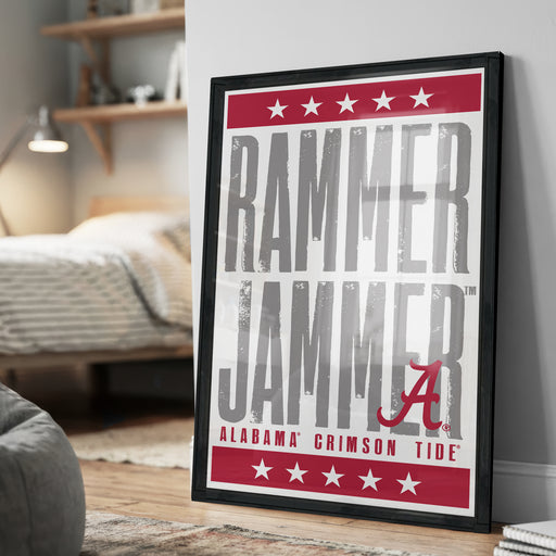 a framed poster with the text "RAMMER JAMMER" and "ALABAMA'S CRIMSON TIDE" prominently displayed.