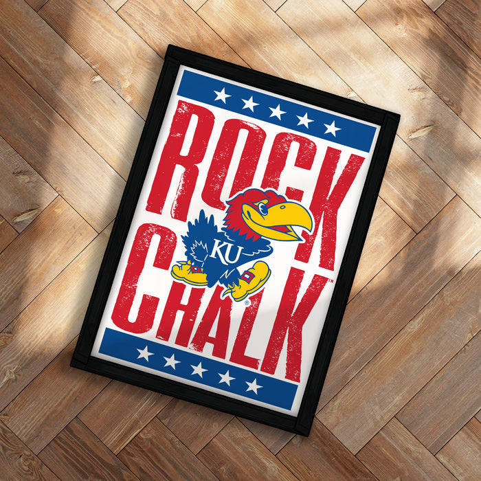 A framed poster featuring the text "ROCK CHALK" and an illustration of a bird, likely representing a sports team or mascot.