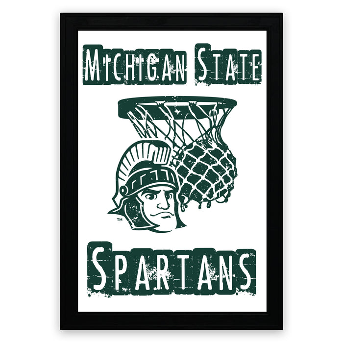 A framed poster featuring the Michigan State Spartans logo, which includes a basketball net and a helmeted figure.