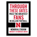 The image is a framed poster with text that reads "THROUGH THESE GATES PASS THE GREATEST FANS IN COLLEGE FOOTBALL. N MEMORIAL STADIUM UNIVERSITY OF NEBRASKA LINCOLN".