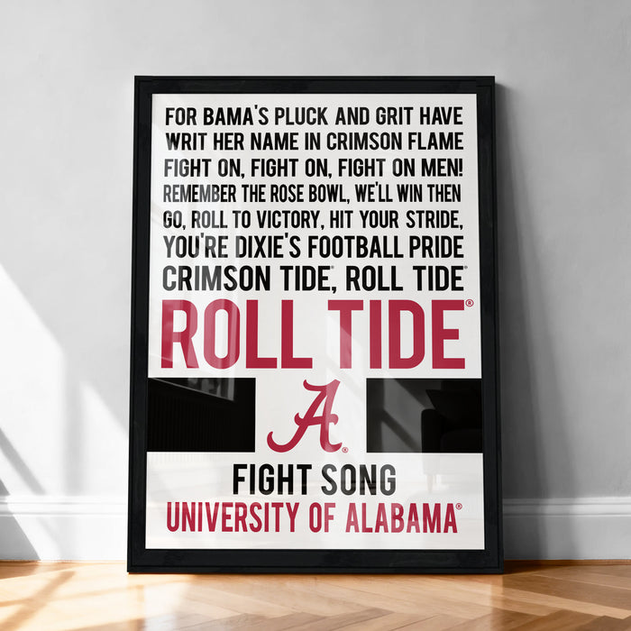 The image is a framed poster with text that reads "For Alabama's pluck and grit have WRIT HER NAME IN CRIMSON FLAME FIGHT ON, FIGHT ON, FIGHT ON MEN! REMEMBER THE ROSE BOWL, WE'LL WIN THEN GO, ROLL TO VICTORY, HIT YOUR STRIDE, YOU'RE DIXIE'S FOOTBALL PRIDE CRIMSON TIDE, ROLL TIDE". The text is in a combination of red and white colors.