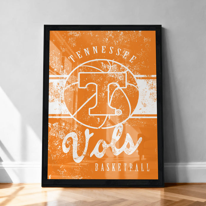 A framed poster with the text "TENNESSEE Vols" and a basketball graphic, indicating the Tennessee State University's basketball team.