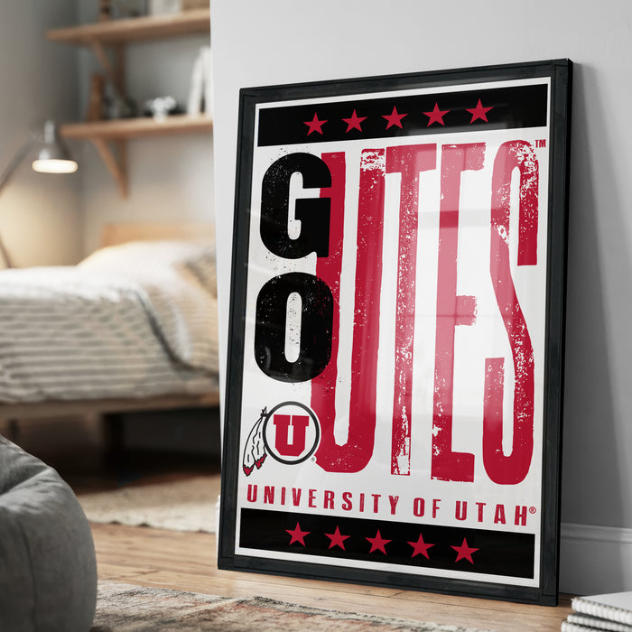 A framed poster with the text "GUTES" and "UNIVERSITY OF UTAH" printed on it, along with a graphic of a Native American headdress.