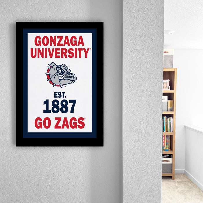 a framed poster of the University of Gonzaga, which is a sports team.