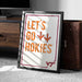 A framed poster with the text "LET'S GO HOKIES" is displayed on a carpeted floor next to a wooden chest.