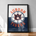 A framed poster with the text "AUBURN TIGERS" prominently displayed, featuring the Auburn Tigers logo.